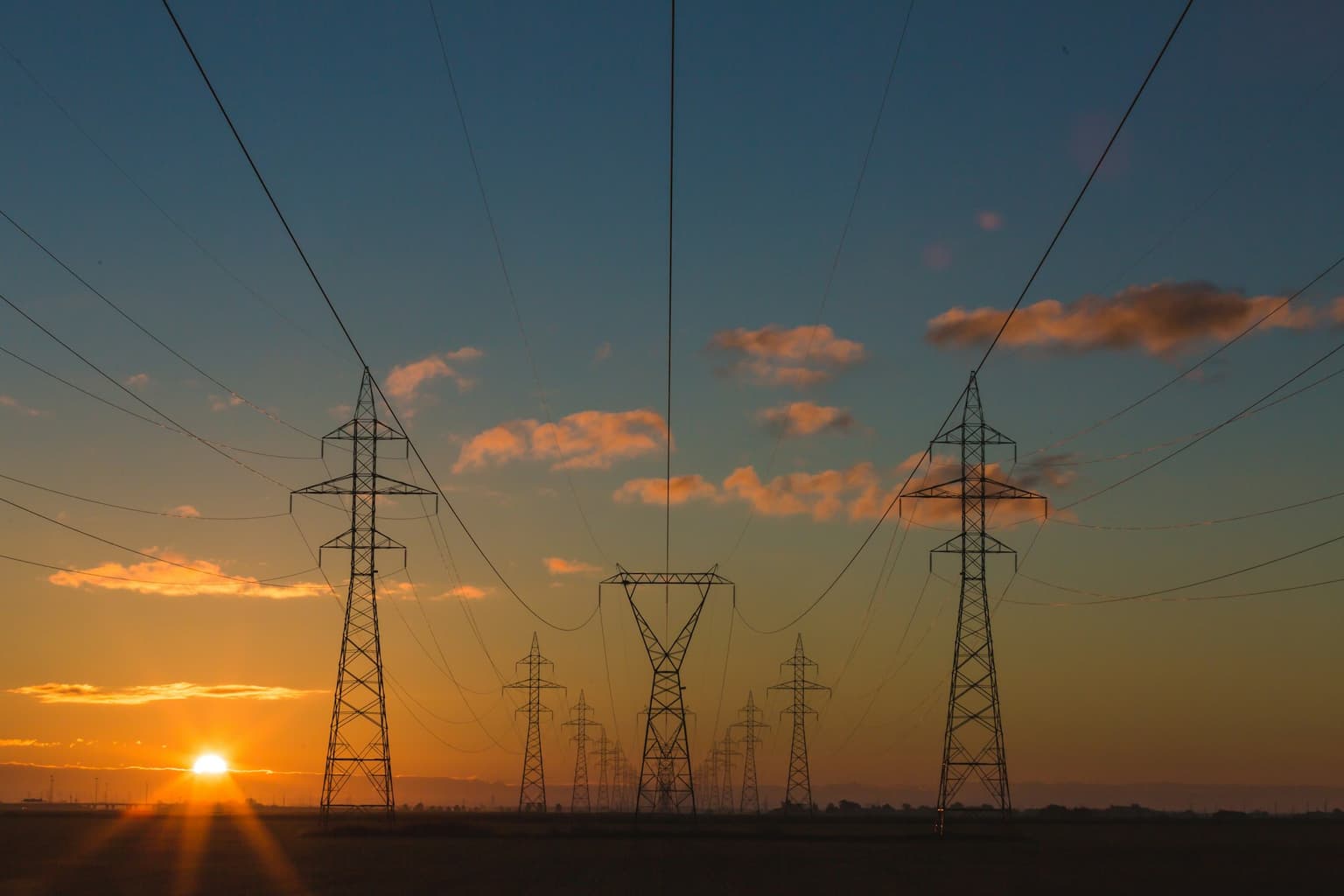 High-voltage transmission corridor at sunset