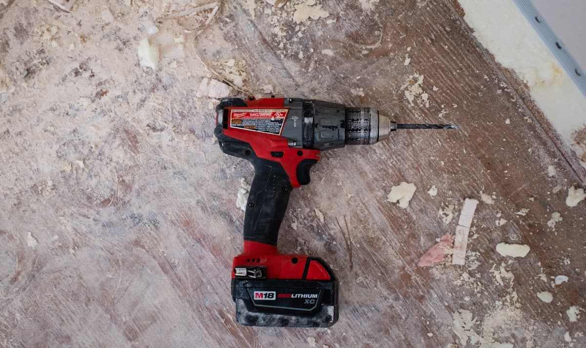 Cordless drill and job-site tools on a work floor