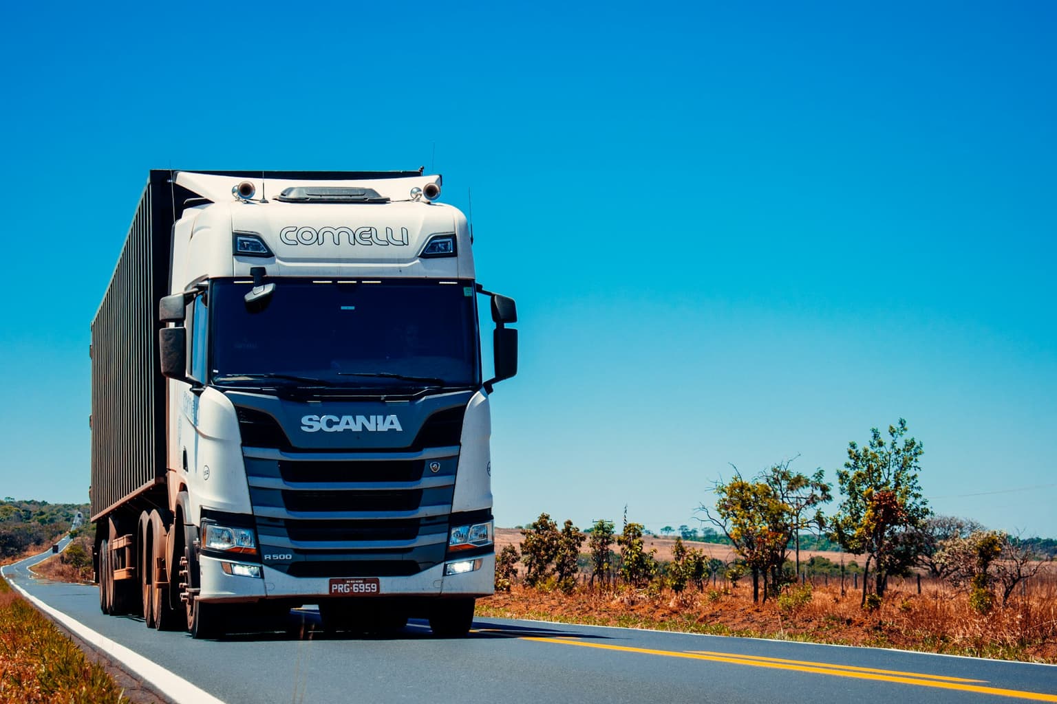 Freight truck on the highway delivering equipment