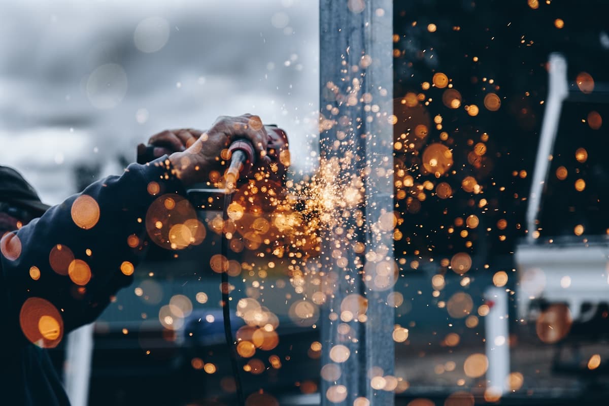 Worker grinding metal on a job site